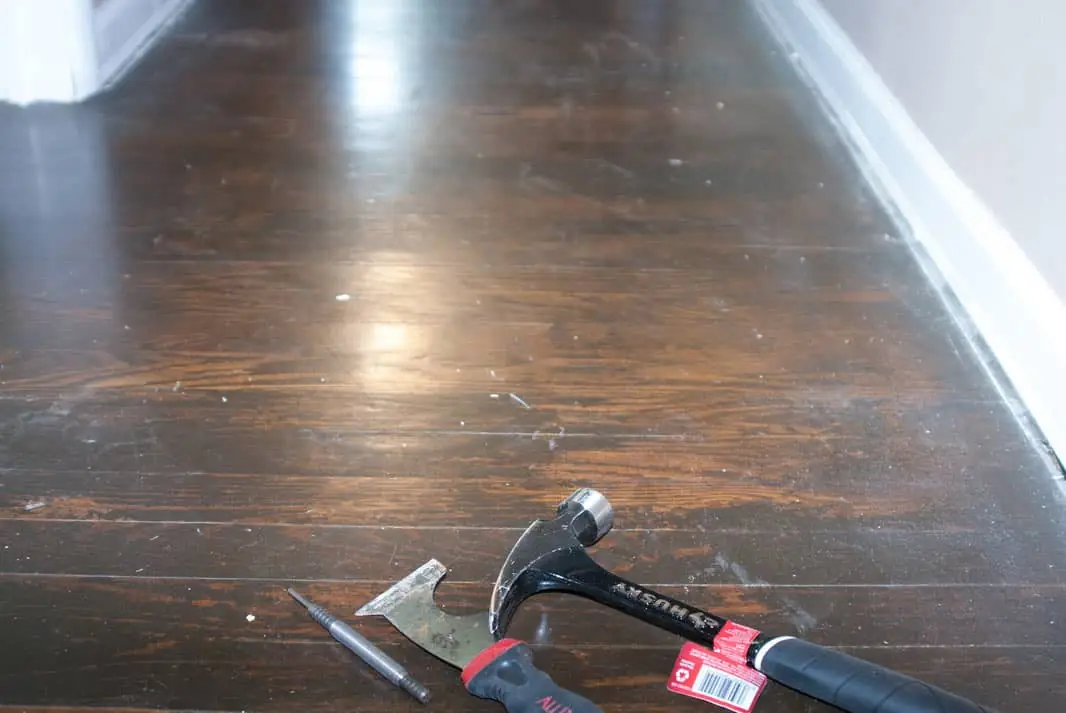 Old dark worn hardwood floors at Fishinger Road before replacement